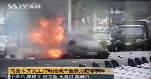 Uighurs Overturn Police Car And Set It Ablaze In PRC