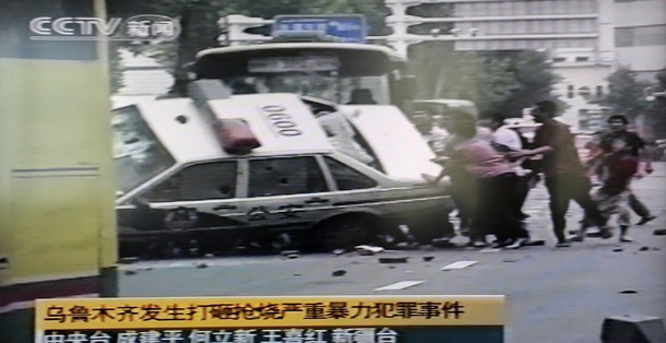 Uighurs Overturning Police Car In PRC