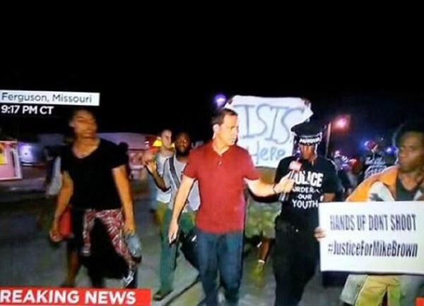 Ferguson Idiot Carrying Sign for ISIS