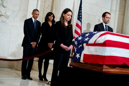 UNITED STATES - FEBRUARY 19: President Barack Obama and First Lady Michelle Obama pay respects to the late Justice Antonin Scalia as he lies in repose in the Supreme Court, February 19, 2016, ahead of his burial tomorrow. Former law clerks also appear near the casket.(Photo By Tom Williams/CQ Roll Call)